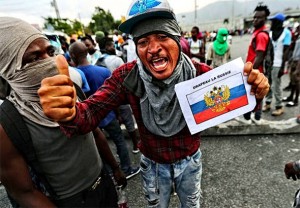 KRVAVI PROSVJEDI NA HAITIJU: ‘Ne želimo Amerikance i njihove marionete, hoćemo Vladimira Putina!’